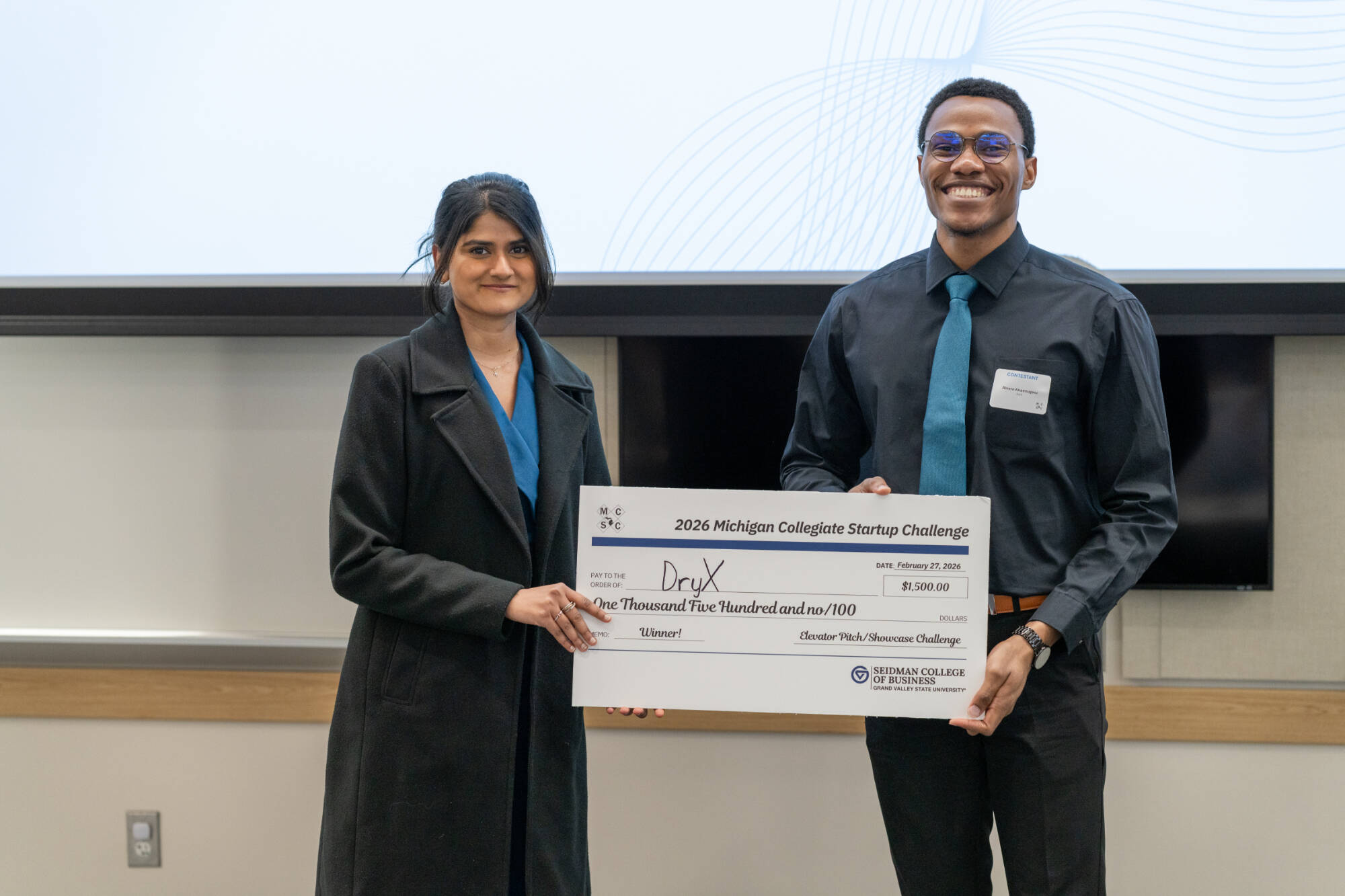 Winning team DryX with their prize check